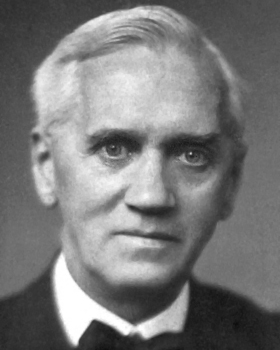 Black and white portrait photograph of Alexander Fleming